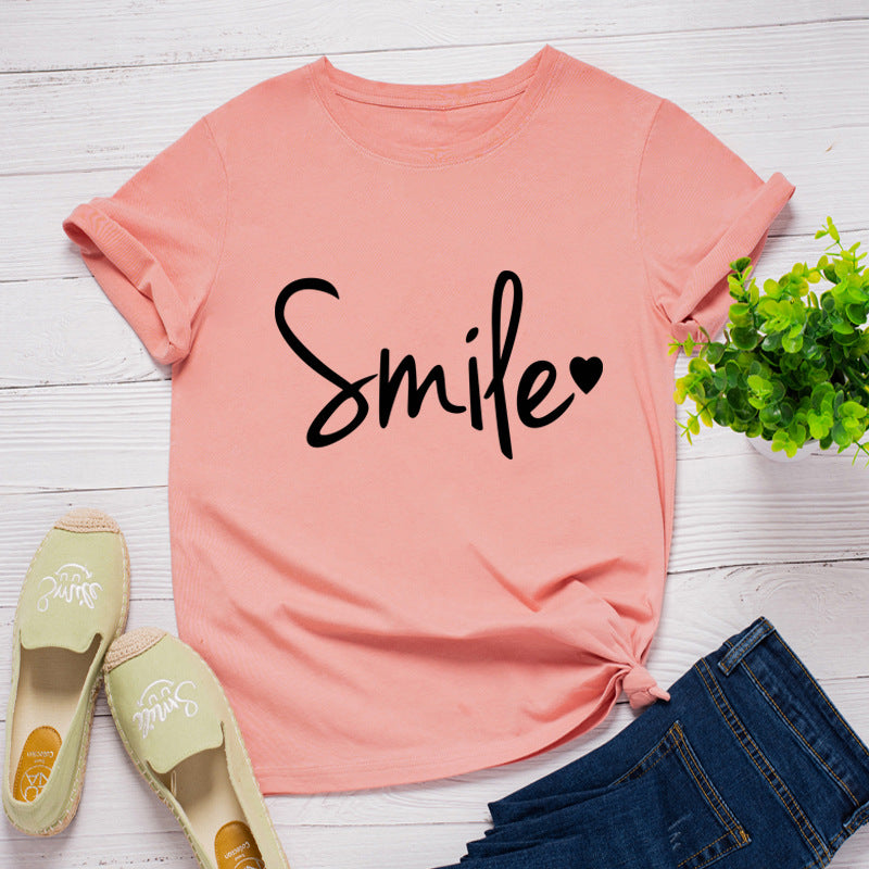 Camiseta con estampado de sonrisa en forma de corazón, manga corta, cuello redondo, corte ancho y cómodo, ideal para un look casual y relajado