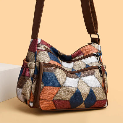 Bolso de mano de cuero con monograma estampado