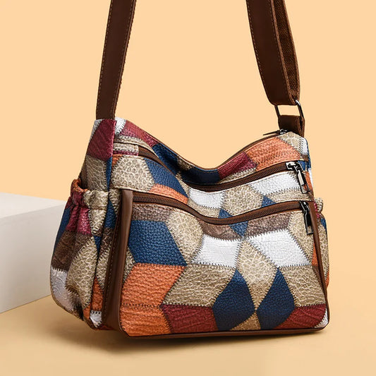 Bolso de mano de cuero con monograma estampado