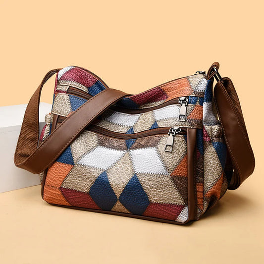 Bolso de mano de cuero con monograma estampado