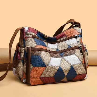 Bolso de mano de cuero con monograma estampado